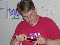 Me sanding the trim for the dollhouse.